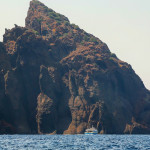 Scandola Nature Reserve boat against cliffs