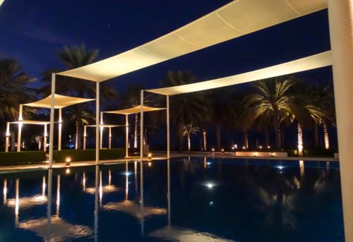 Chedi Muscat main pool night reflections
