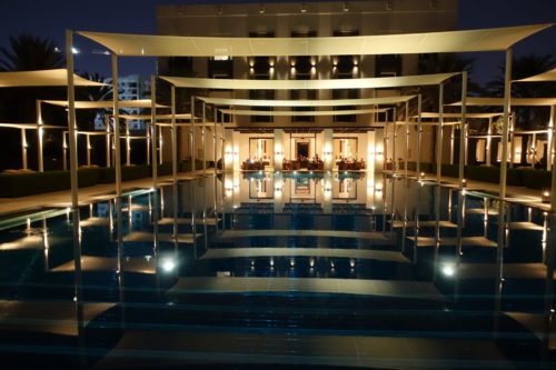 The Chedi Muscat pool reflections night